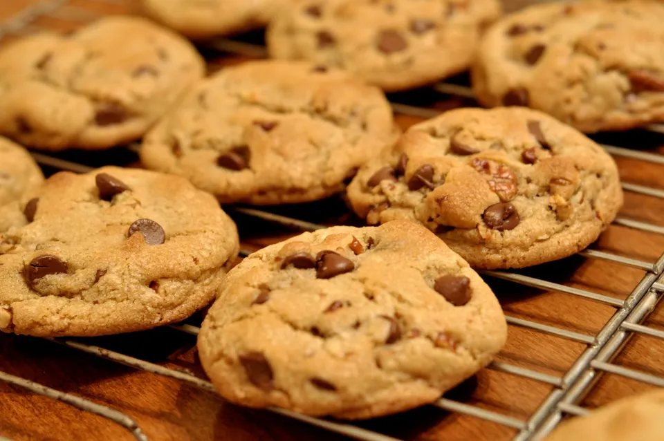 Chocolate chip cookies cooling on a wire rack